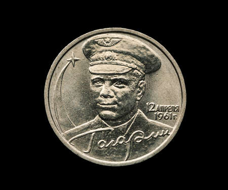 Commemorative russian coin with Yuri Gagarin portrait isolated on black, 12 of april 1961, USSRの写真素材