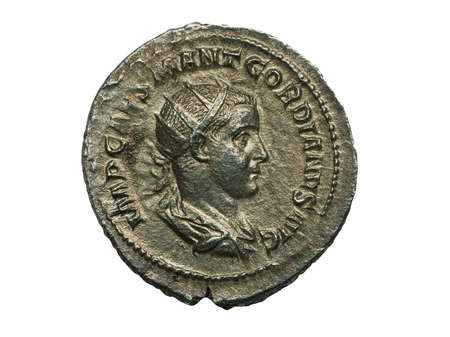 Ancient roman silver coin of emperor Gordianus isolated on white, macro shotの写真素材