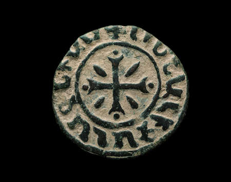Ancient copper armenian coin isolated on black, close-up shotの写真素材