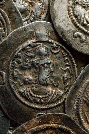 Vertical photo of ancient silver Sassanian coins, closeupの写真素材
