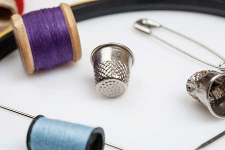 Close-up shot of items for sewing on a white background.の写真素材