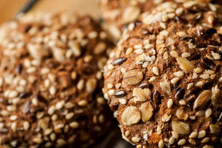 Macro shot of oatmeal cookies with seeds and nuts on the top.の写真素材