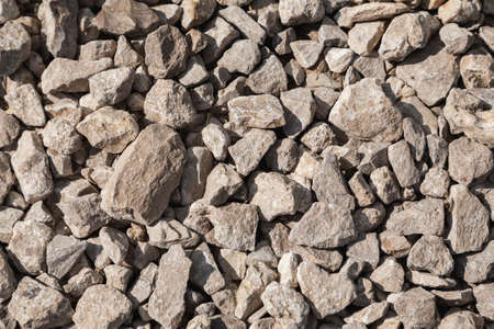 Small stone in the sunlight texture, selective focus