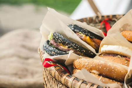 Fresh hamburgers in basket, closeup shot, selective focusの写真素材
