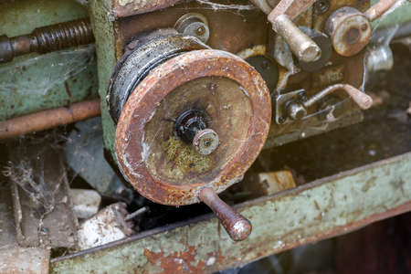 Rusted control element of an old lathe machine, selective focusの写真素材