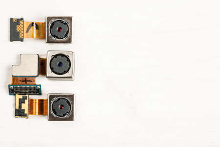 Smartphone camera modules on a white background, closeup