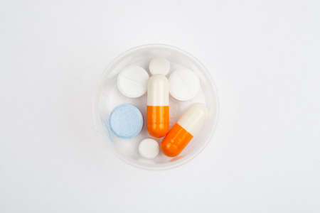 Medications and pills on a white background closeup shotの写真素材
