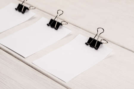Blank sheets of white paper with paper clip on a white backgroundの写真素材