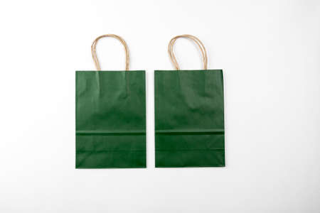 Two green paper bags on a white background top viewの写真素材