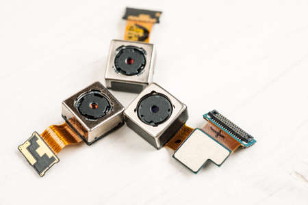 Smartphone camera modules on a white background, closeupの写真素材