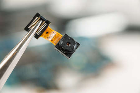 Smartphone camera module in repair shop, macro shot