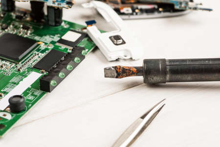 Disassembled cell phones and other gadgets in repair shopの写真素材