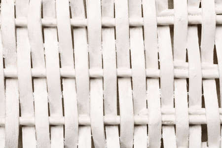 Fragment of an white wicker wooden basket, abstract textureの写真素材
