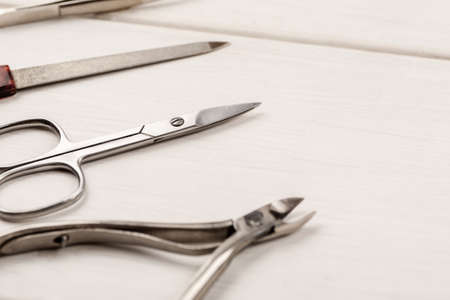 Items for manicure on a white wooden tableの写真素材