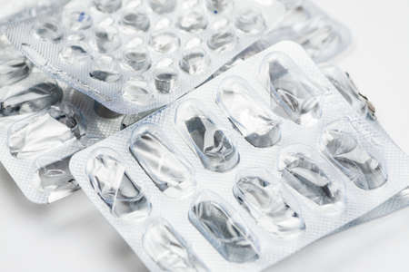 Empty packing from different medications on a white background