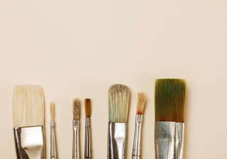 Paintbrushes on a table closeup shot, selective focus