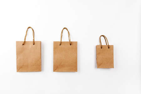 Three paper bags with handles on a white background, top viewの写真素材