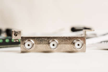 Tv cable splitter on a white table in repair shop, macro shotの写真素材