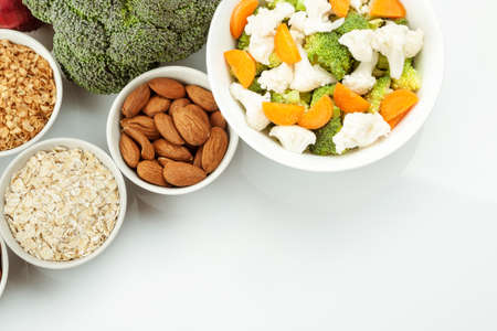 Fresh raw vegetables with nuts and cereals for cooking or eating. Vegetarian food. Top viewの写真素材