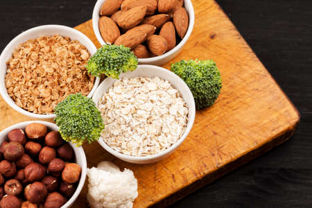 Fresh raw vegetables with nuts and cereals for cooking or eating. Vegetarian food. Top viewの写真素材
