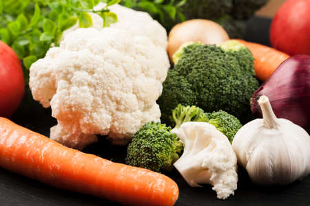 Fresh raw vegetables with nuts and cereals for cooking or eating. Vegetarian food.の写真素材