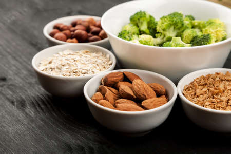 Fresh raw vegetables with nuts and cereals for cooking or eating. Vegetarian food.の写真素材