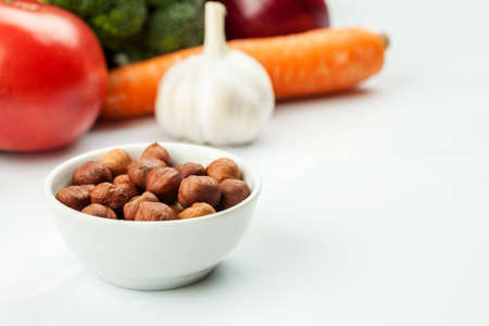 Fresh raw vegetables with nuts and cereals for cooking or eating. Vegetarian food.の写真素材