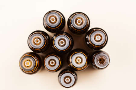 Brown glass small bottles with droppers, cosmetic and essential oils set, top viewの写真素材