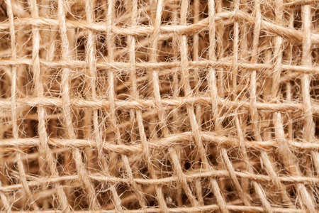 Burlap sack abstract texture with threads, macro shotの写真素材