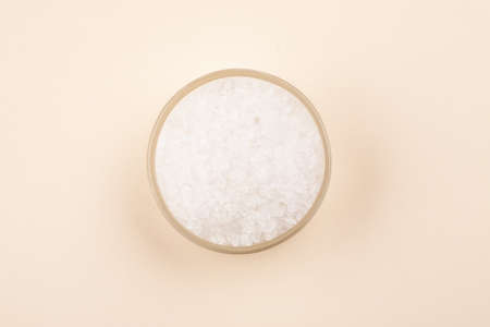 White sea salt in glass container top viewの写真素材