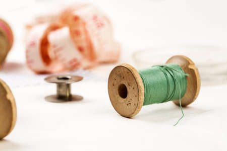 Set of tools and accessories for sewing and needlework with threads in spools, needles, measuring...