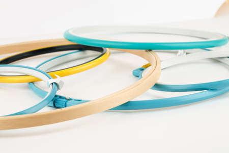 Many plastic and wooden embroidery frames on a white backgroundの写真素材