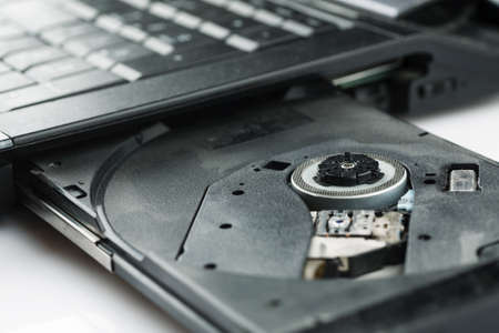 Open cd tray of laptop closeup shot
