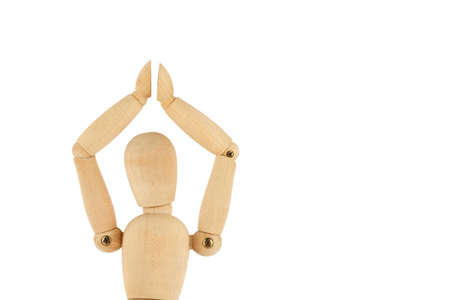 Wooden dummy hands up isolated on whiteの写真素材