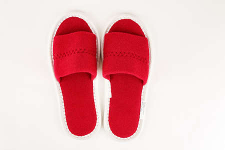 Red soft slippers isolated on whiteの写真素材