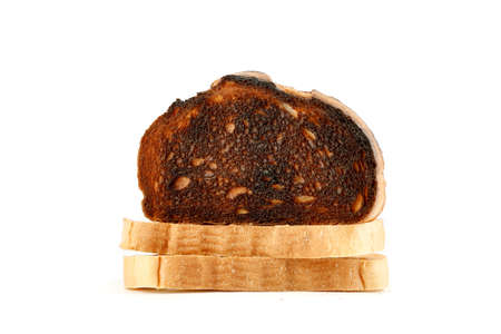 Burnt toast isolated on white, closeup shot