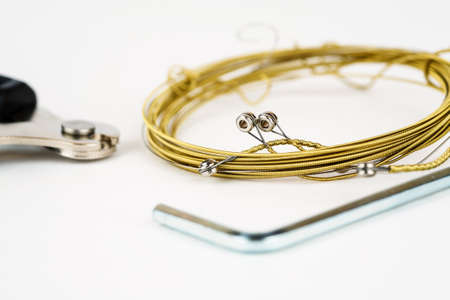 Bronze strings for acoustic guitar with tools for strings changeの写真素材