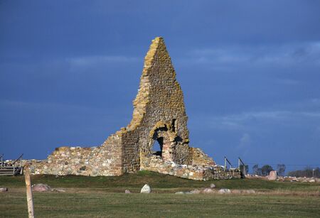 Old church ruin and blue sky green grassの写真素材