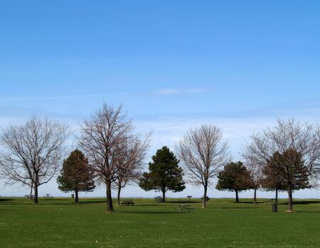 A quiet park on the edge of a large lakeの写真素材
