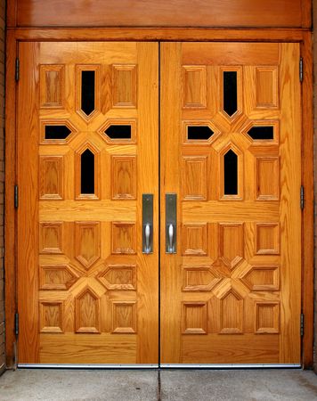 Set of double wooden church doors with cross patternsの写真素材