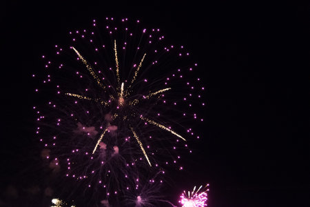 Colorful fireworks in the night sky, close-up view.