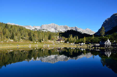 Mountains and Cottage reflectionの写真素材