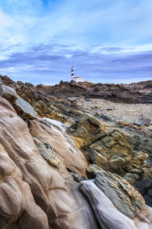 Beautiful and mysterious lighthouse in a cloudy dayの写真素材
