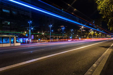 Blue and red city trail lightsの写真素材