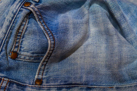 Blue jeans texture with close-up pocket and buttonの写真素材