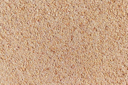 Close up texture of beige stone wall background