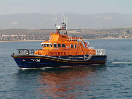 Lifeboat at sea off coast of Weymouth, Dorset                               
