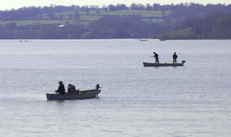 Fishing on calm and sunny dayの写真素材