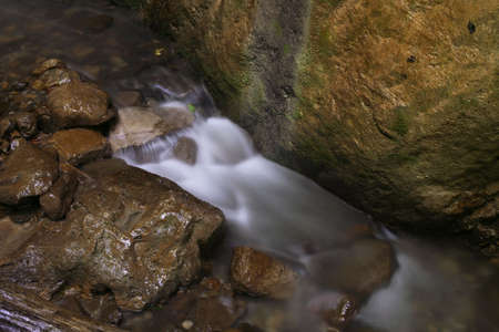 The stream runs between rocks