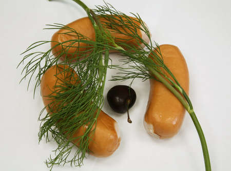 Sausages covered by dill are an tasty breakfastの写真素材